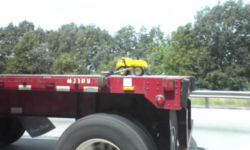 Flatbed Hauling A Tonka Truck