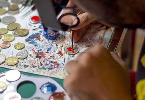 Andre Levy Painting Tiny Portraits On Coins