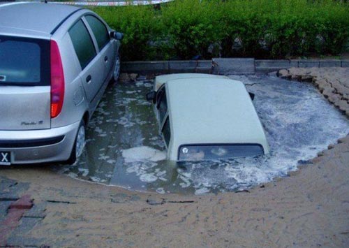 Car Disappearing In A Parking Lot Sink Hole