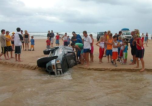 SUV Buried In A Beach Sinkhole