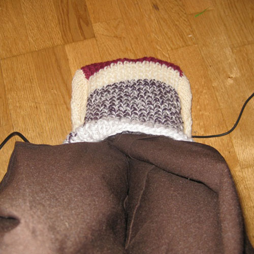 Knit Sock Feet Warmer Heated By A Laptop Charger