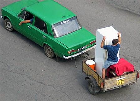 Holding A Refrigerator Upright In A Trailer While Being Towed