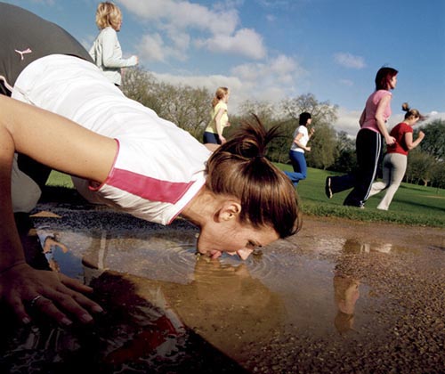 Runner Drinking Water From A Puddle | Keep Hydrated