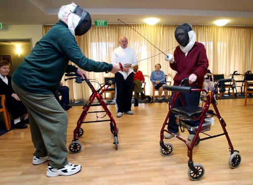 Senior Citizens Fencing With Walkers