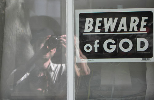 Beware of God Sign