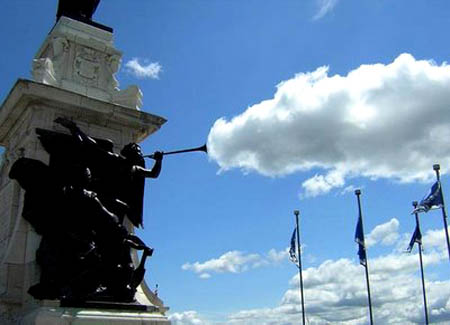 Statue Blowing A Cloud Out Of Its Horn