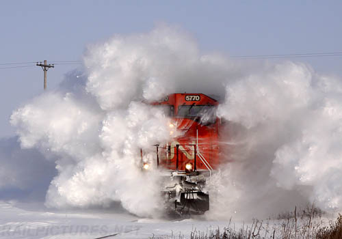 CN Train Driving Through Snow Drift