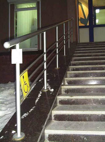 Wheelchair Accessible Sign Next To Flight Of Stairs