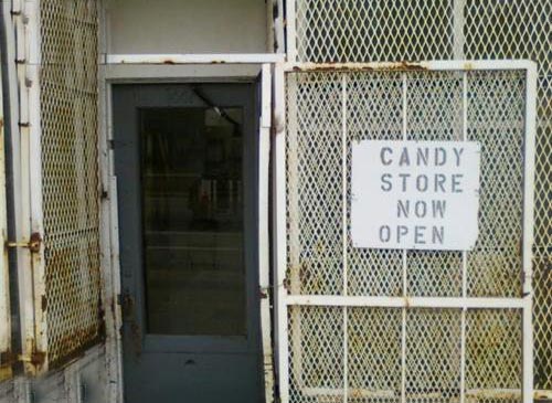 Caged Candy Store Now Open Sign