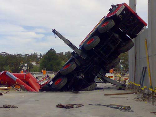 Crane Collapses Through Parking Lot