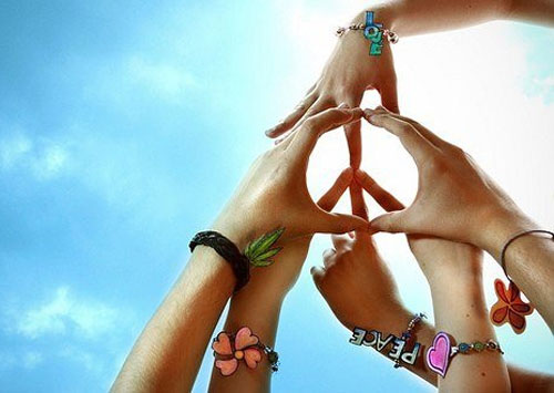 Hands Together Making A Peace Sign