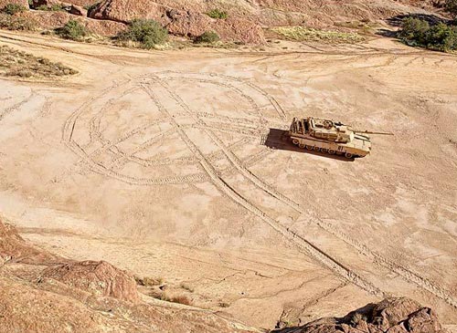 Tank Making A Peace Symbol In The Sand